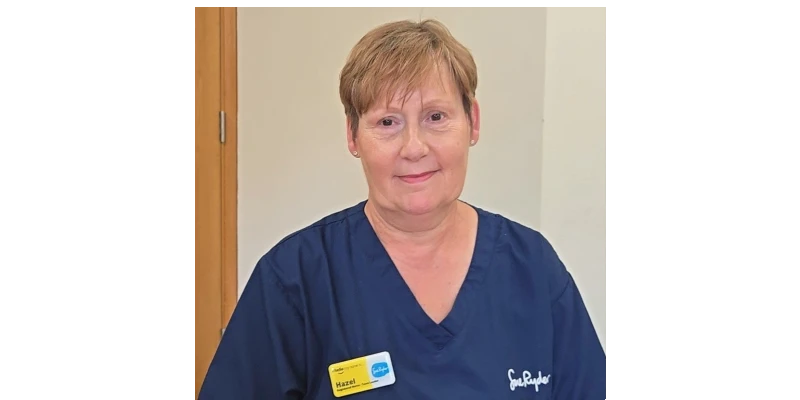 Hazel King Sue Ryder palliative care nurse wearing navy uniform