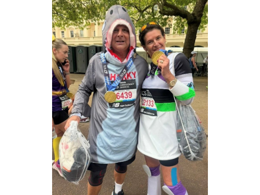 Jane and Mark posing after the London Marathon