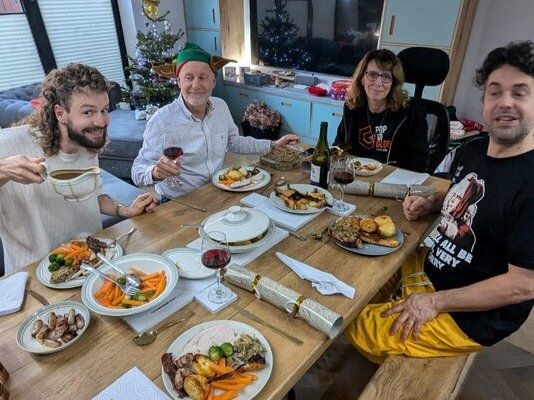 Phil and his family having their last Christmas lunch together at home