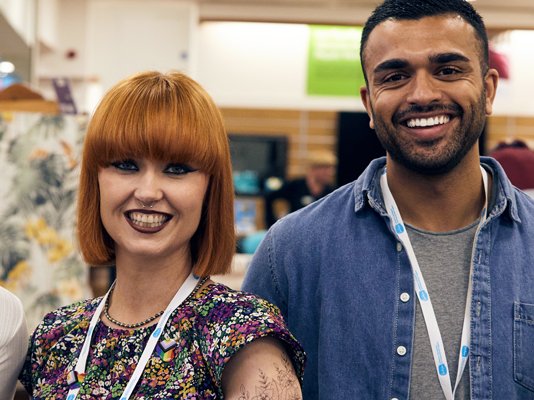 Three Sue Ryder shop volunteers together on the shop floor
