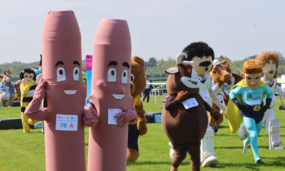Sue Ryder mascots take part in the Mascot Gold Cup race alongside other colourful characters.