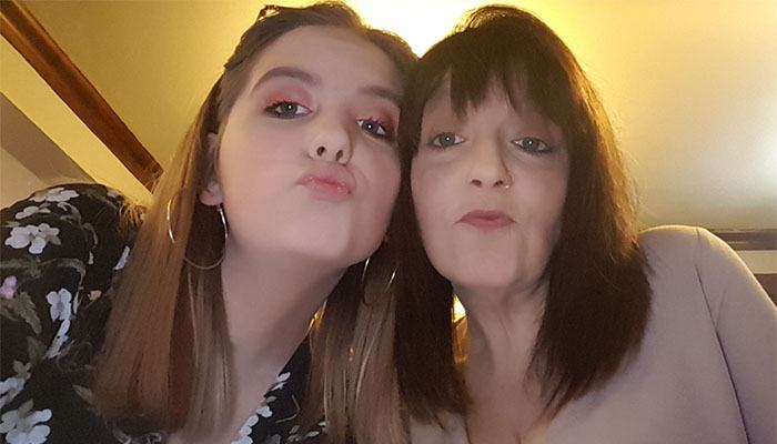 Zoe's younger sister with her mum