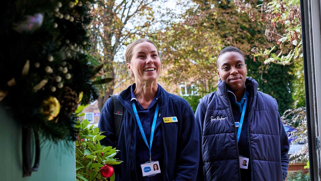 Image of two Sue Ryder Nurses at a home visit
