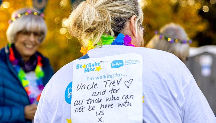 A Starlight Hike Walker's in memory message saying 'Uncle Trev and for all those who can not be here with us'.