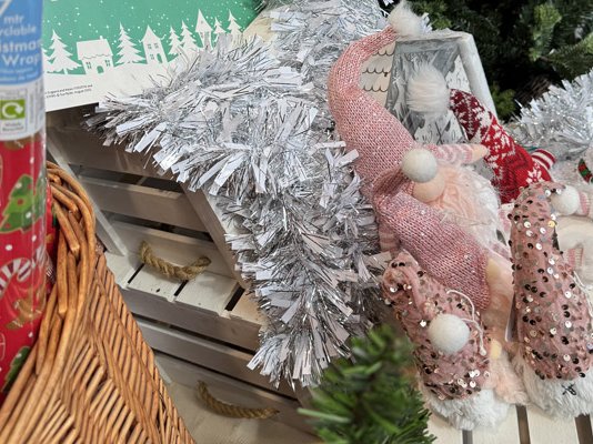Christmas decorations, toys and gifts in a hamper