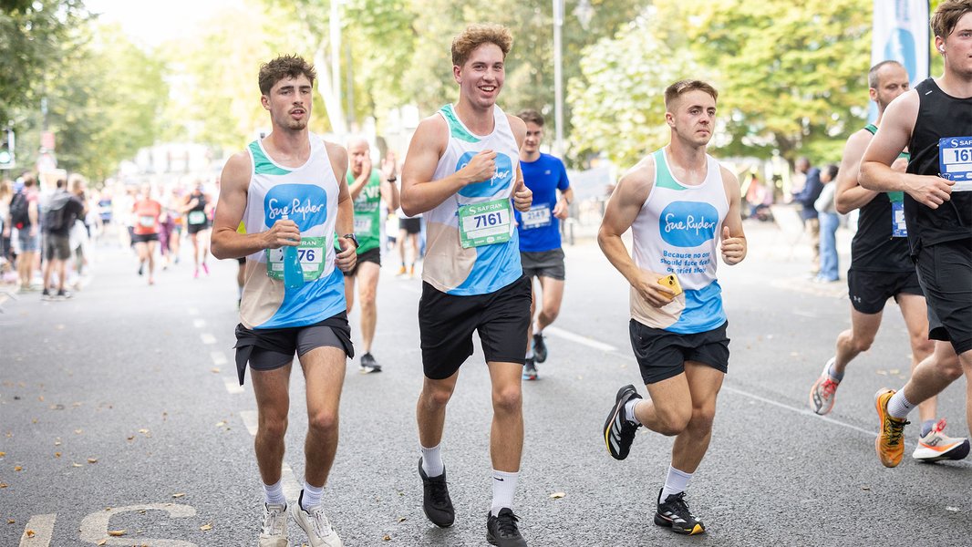 Three Sue Ryder runners racing together during the Run Cheltenham event